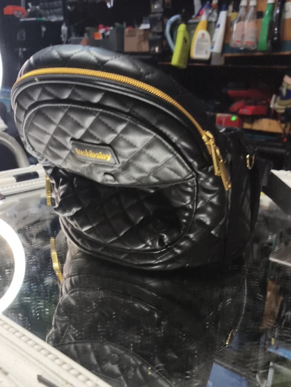 a MINT Tushbaby Quilted Vegan Black Leather Bag. Excellent.